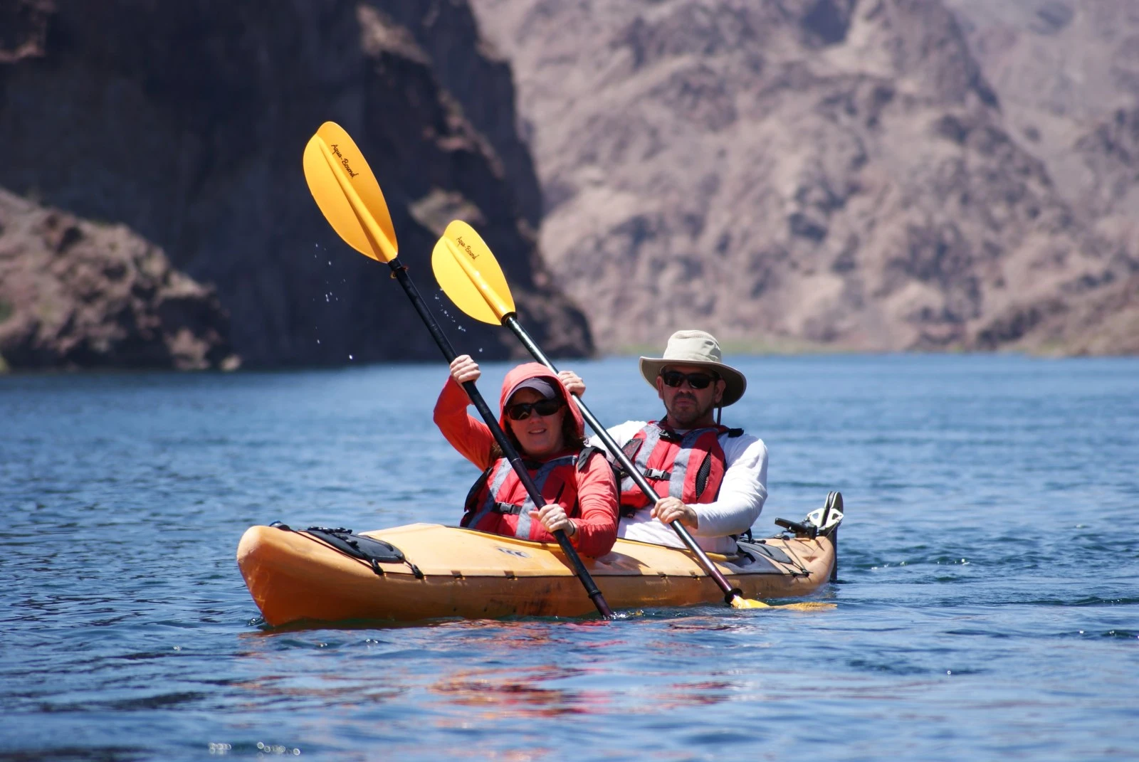 Kayakers paddling through Emerald Cave as part of an Evolution Expeditions tour