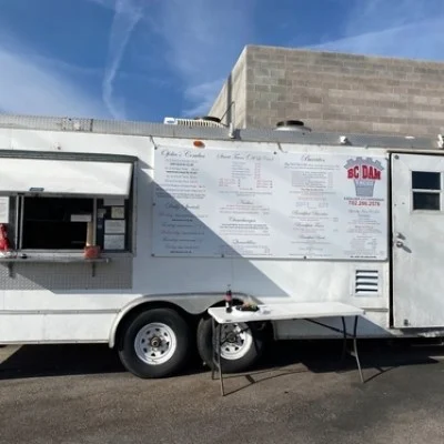 White BC Dam Tacos food truck with its serving window open