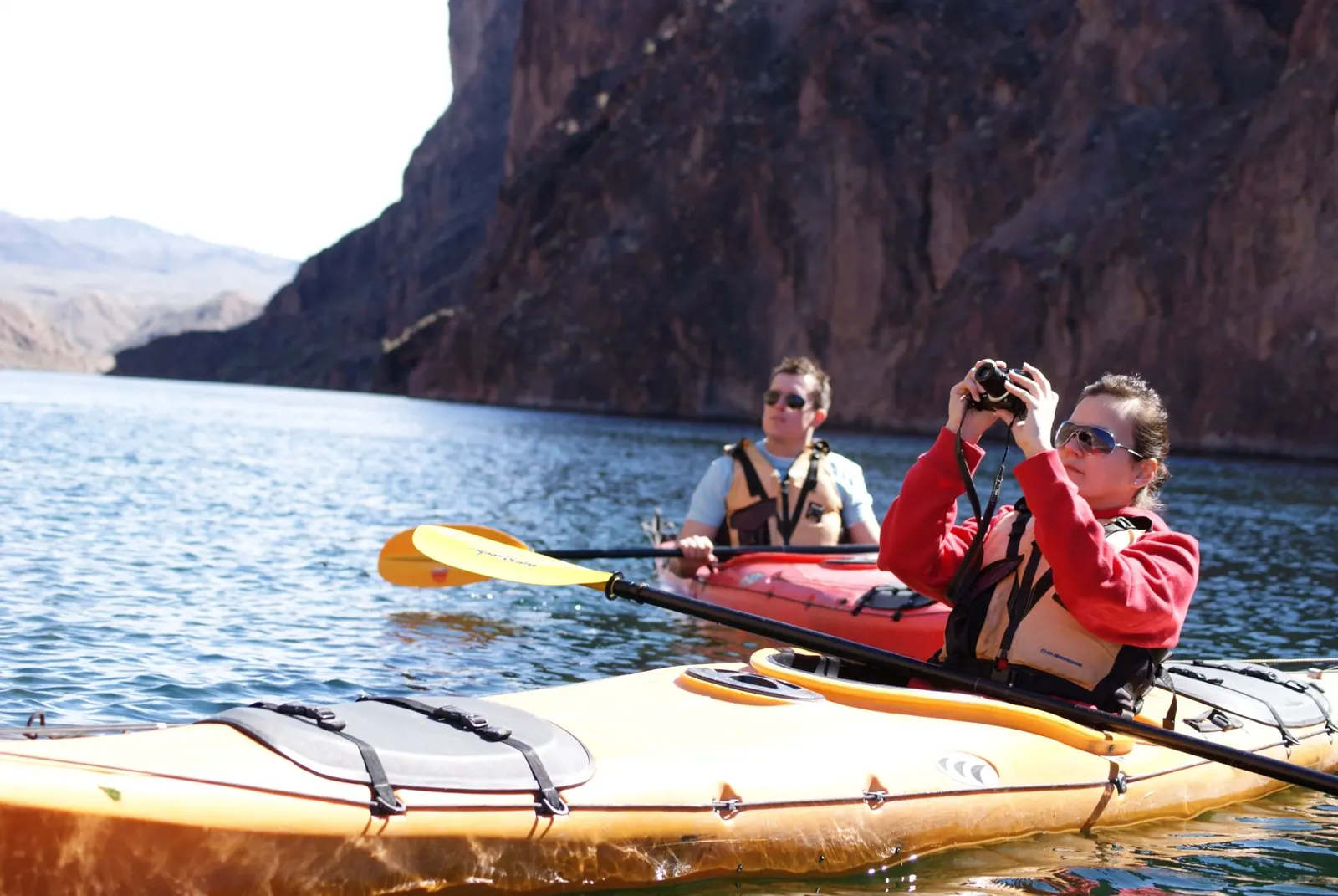 Kayakers paddling and taking a picture