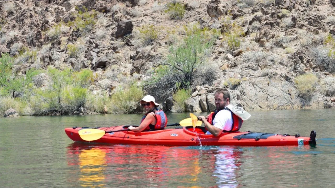 Kayakers exploring a calm desert waterway near Las Vegas