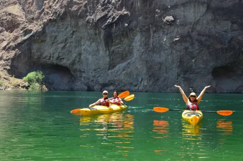Two kayaks with a group of guests on the Colorado River