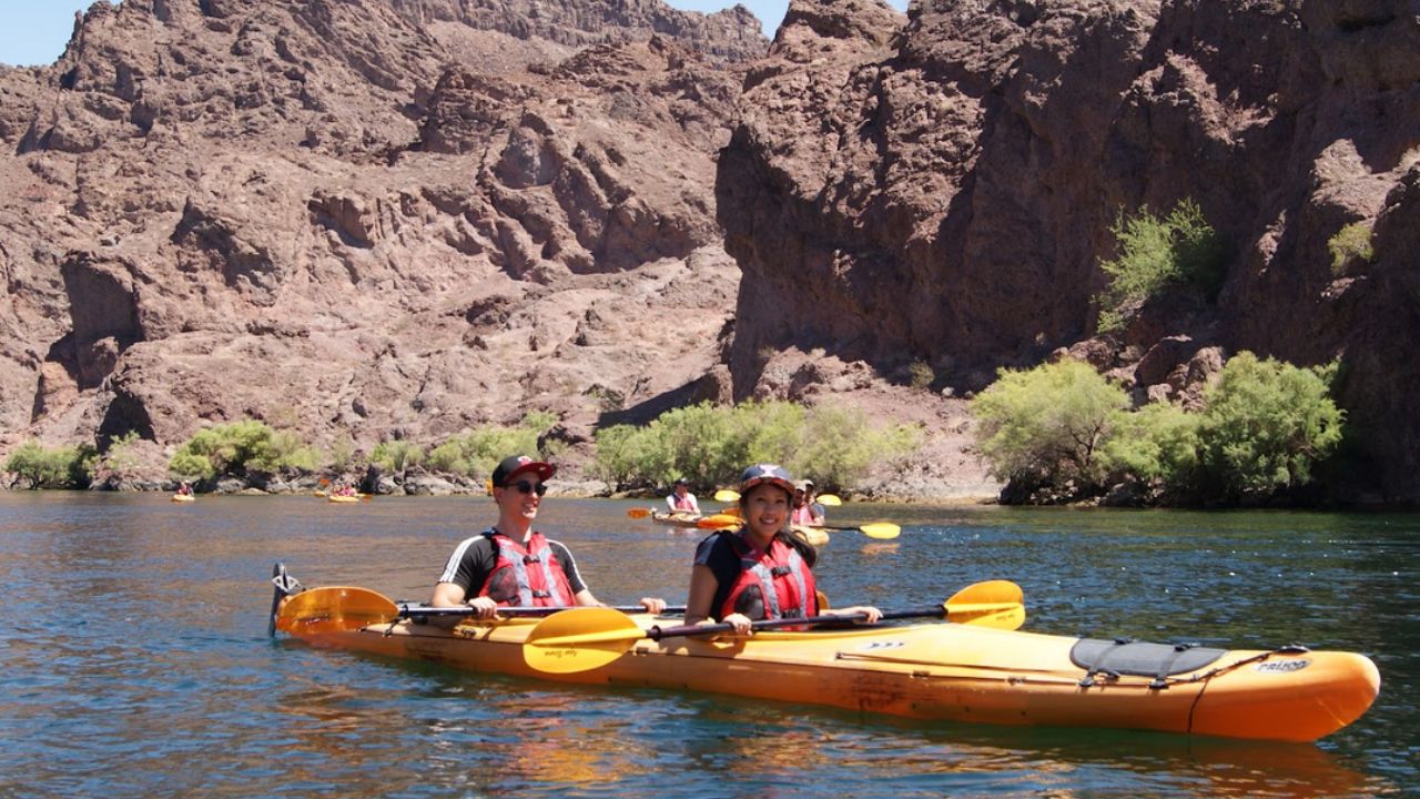 People kayaking as part of the Evolution Expeditions tour